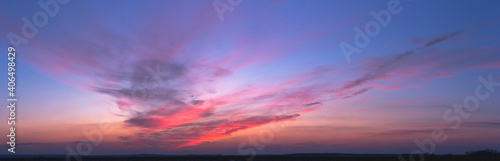 Colorful sky with red clouds after sunset © Taras Rudenko