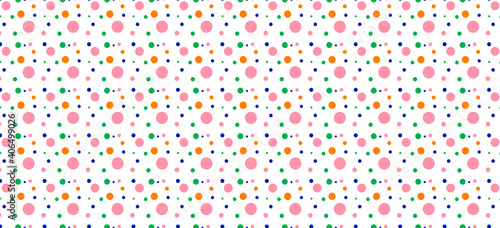 abstract colorful polka dot background in complementary colors of pink, blue, green and orange