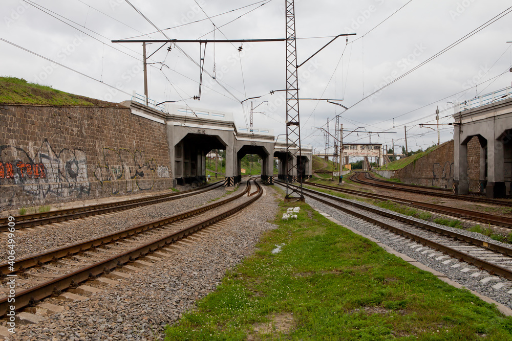 Railroad rails passing under the bridge Railroad rails passing under the bridge