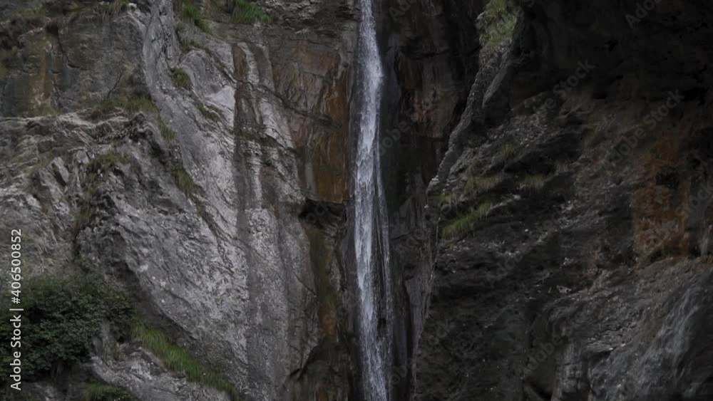 Mesmerizing beauty of towering waterfall in Ledro,Italy creates a unique atmosphere. Mesmerizing beauty of towering waterfall in Ledro,Italy creates a unique atmosphere.