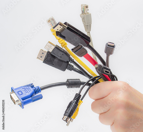 Tableau sur toile cables in hand isolated on white background