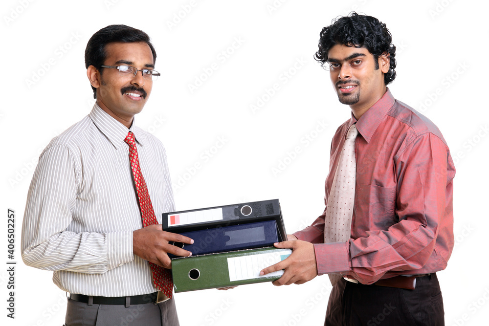 Two Indian business peoples with files on white Two Indian business peoples with files on white