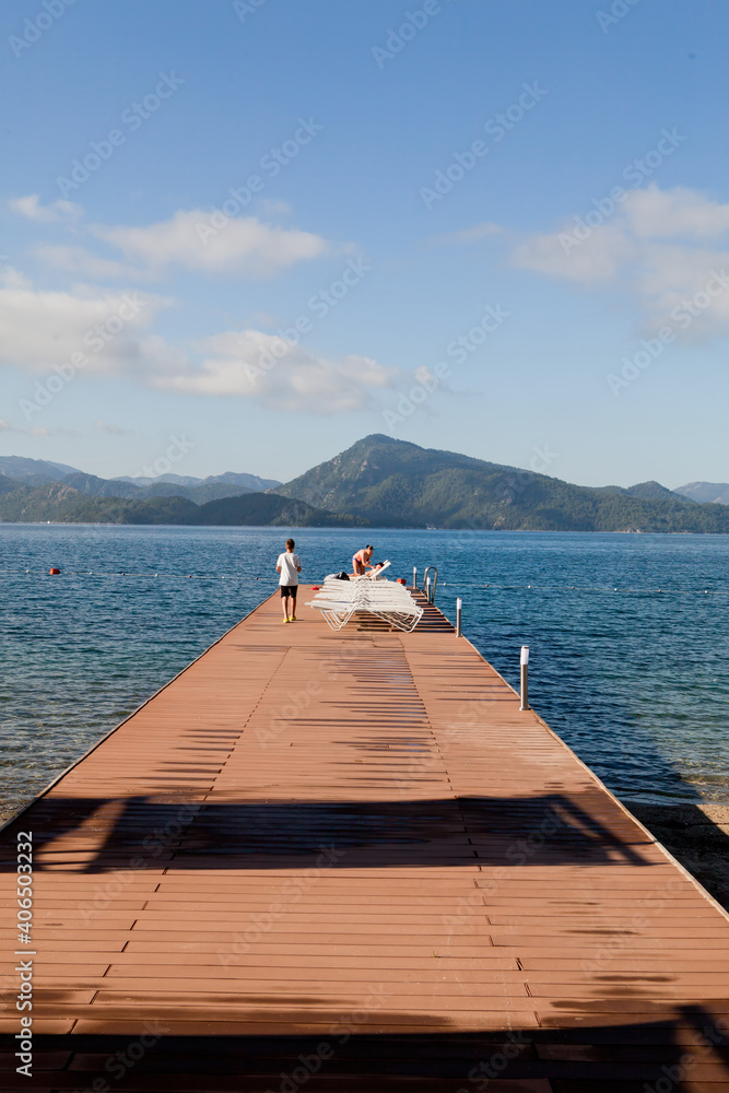 Wooden pier extending into the sea allowing you to admire the horizon