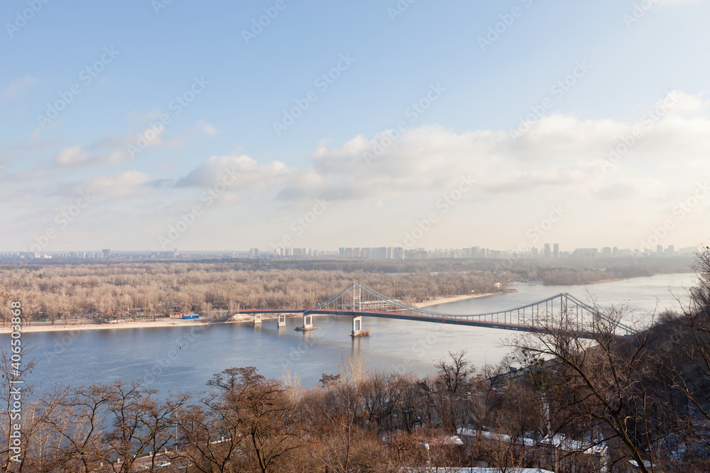 Obraz premium Bridge over the river in the city in early spring, view from above
