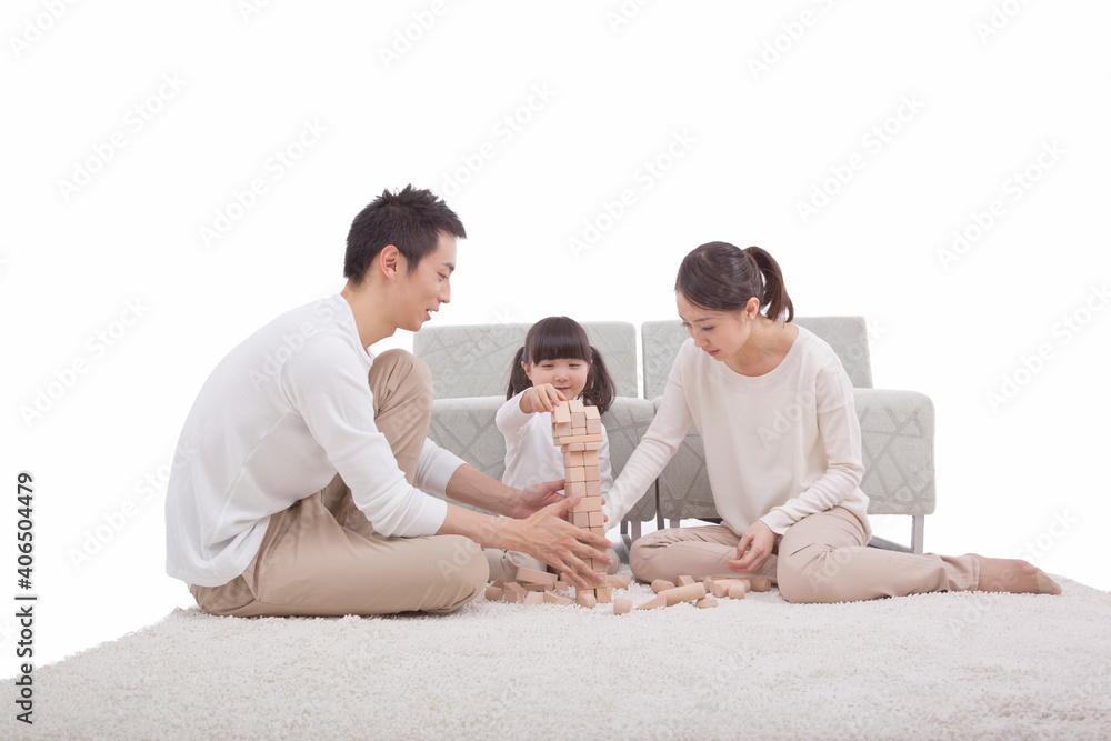 Portrait of daughter playing building blocks with parents Portrait of daughter playing building blocks with parents