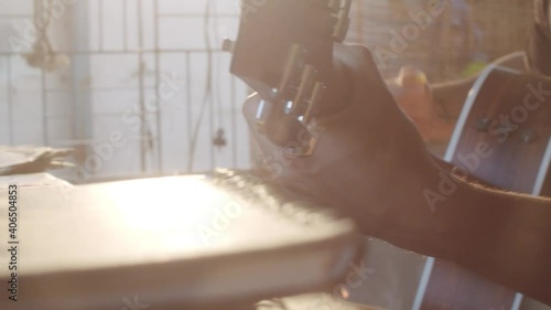 Musician playing his best with his guitar on a beautiful sunser