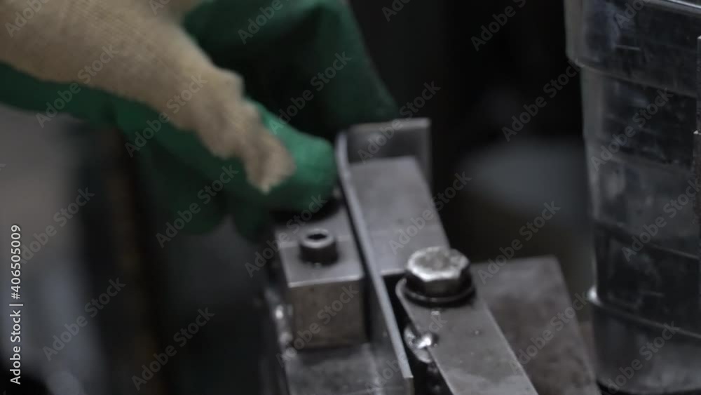 Metal brackets for downpipes being bent into pieces Metal brackets for downpipes being bent into pieces