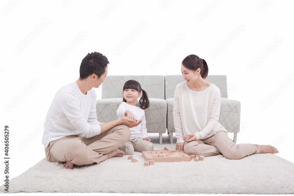 Portrait of daughter playing building blocks with parents Portrait of daughter playing building blocks with parents