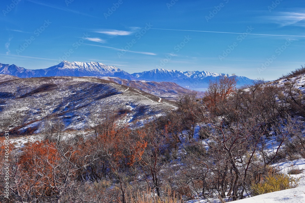 Winter Landscape panorama Oquirrh and Wasatch mountain views from Yellow Fork Canyon County Park Rose Canyon rim hiking trail by Rio Tinto Bingham Copper Mine, Utah. United States.