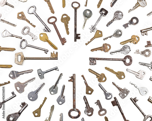 Background of assorted old multi-colored metal antique keys of different shapes. Home security concept.