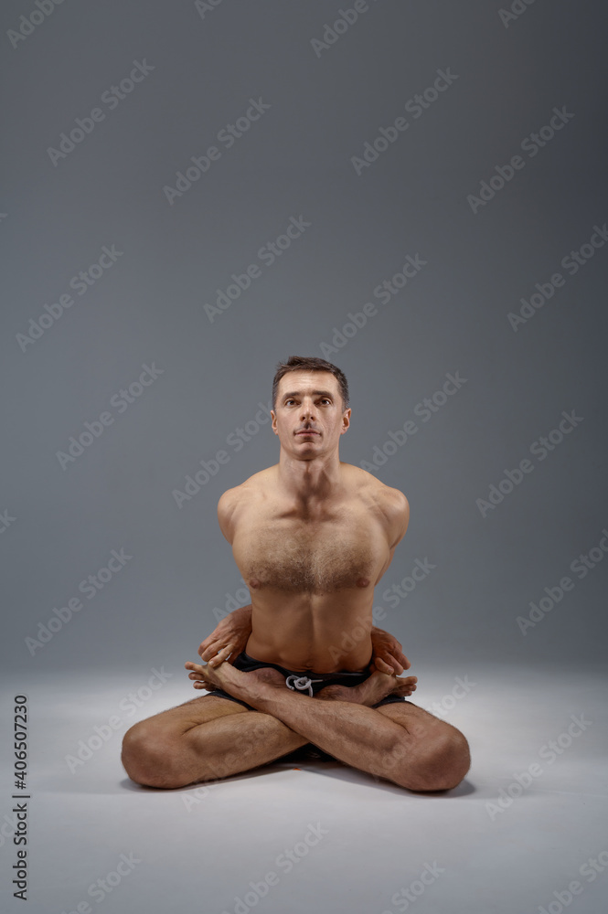 Yoga sits in classical pose, meditation position Yoga sits in classical pose, meditation position