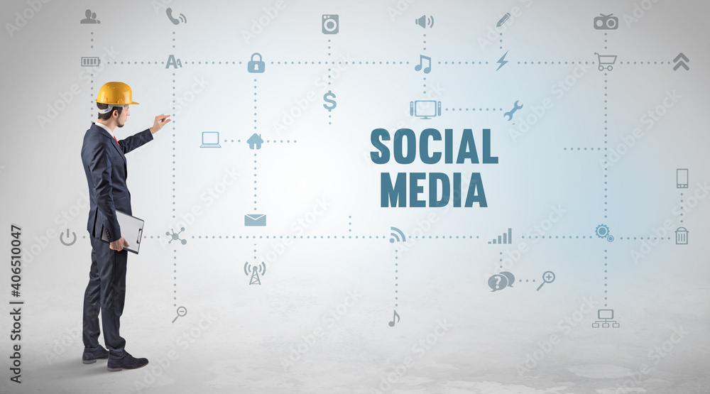 Engineer working on a new social media platform with SOCIAL MEDIA inscription concept Engineer working on a new social media platform with SOCIAL MEDIA inscription concept