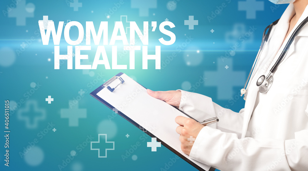 doctor writes notes on the clipboard with WOMAN’S HEALTH inscription, first aid concept doctor writes notes on the clipboard with WOMAN’S HEALTH inscription, first aid concept