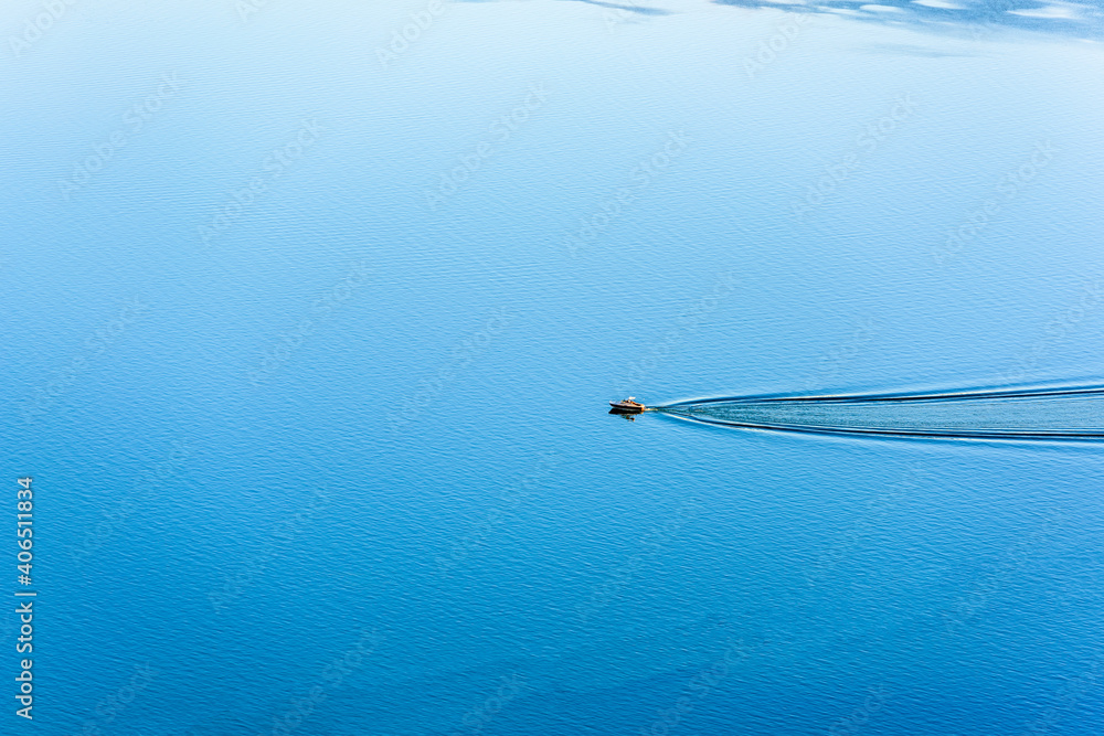Leisure Boat on calm lake with copy space Leisure Boat on calm lake with copy space
