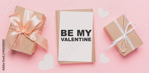 Gifts with note letter on isolated pink background, love and valentine concept with text be my Valentine © Daria Lukoiko
