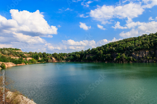 View of the lake at abandoned quarry on summer © olyasolodenko