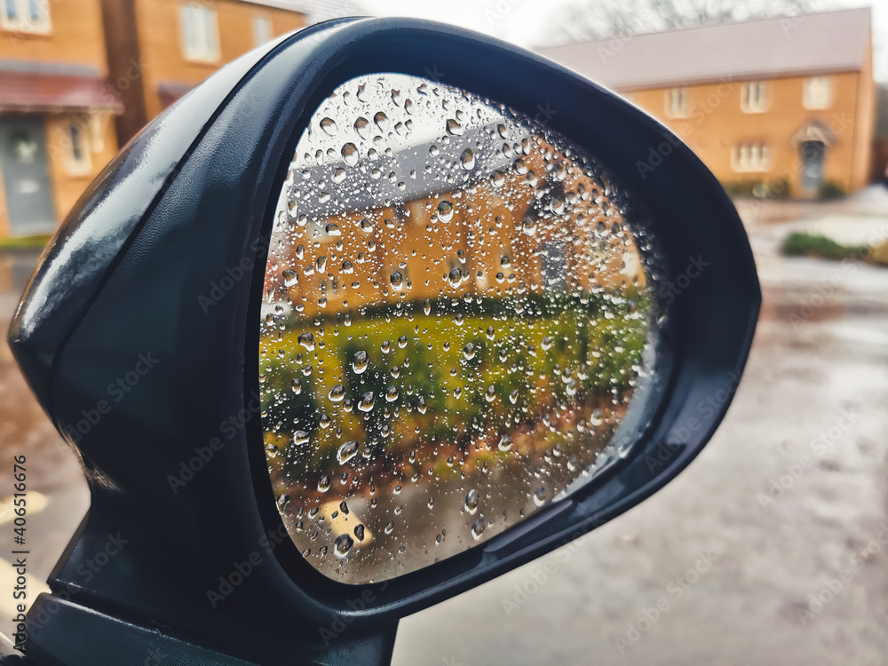 Rain drops on the wing mirror of a car Rain drops on the wing mirror of a car