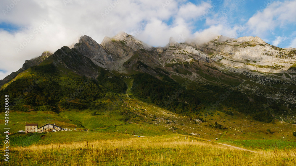 Fototapeta premium landscape with sky , col des aravis , France. Ferme laitière 