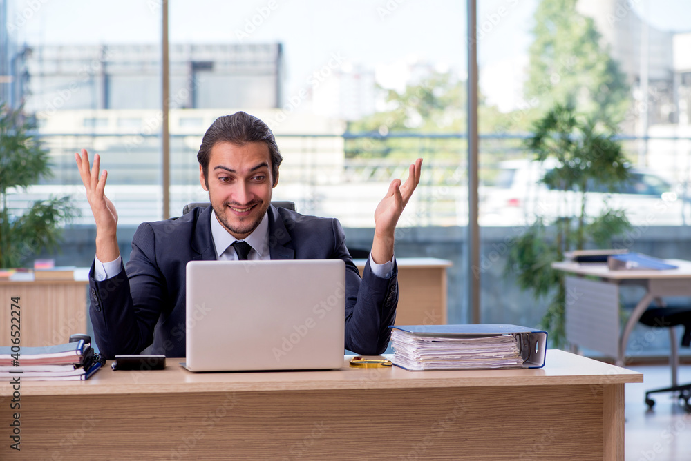 Young businessman employee working in the office Young businessman employee working in the office