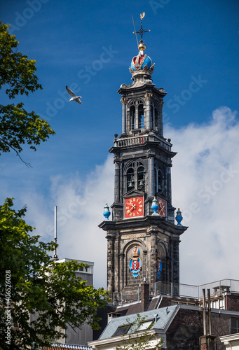 Westerkerk tower stands above the city of Amsterdam， Netherlands photo