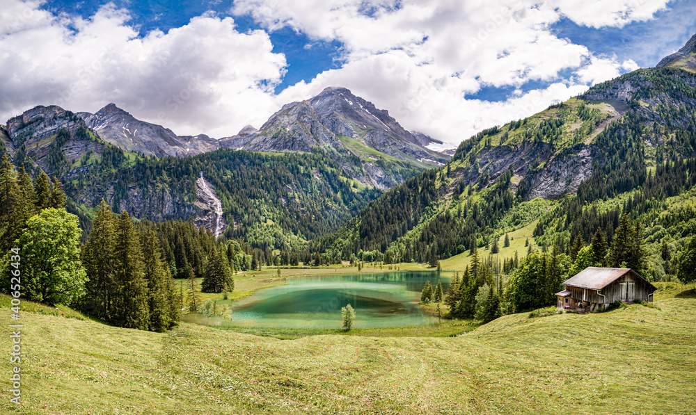 Panoramic view of the mountain landscape on the lake Lauenen, Switzerland