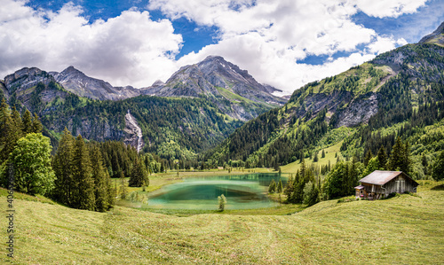 Panoramic view of the mountain landscape on the lake Lauenen, Switzerland