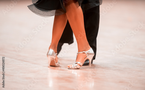 Man and woman dancer latino international dancing. Ballroom dancing is a team sport. Vintage color filter..