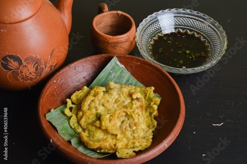 Tempeh mendoan originates from the city of Purwokerto in Central Java, Indonesia. Most people consider tempeh mendoan as a snack, and is one of the more popular Indonesian street food, for good reason photo