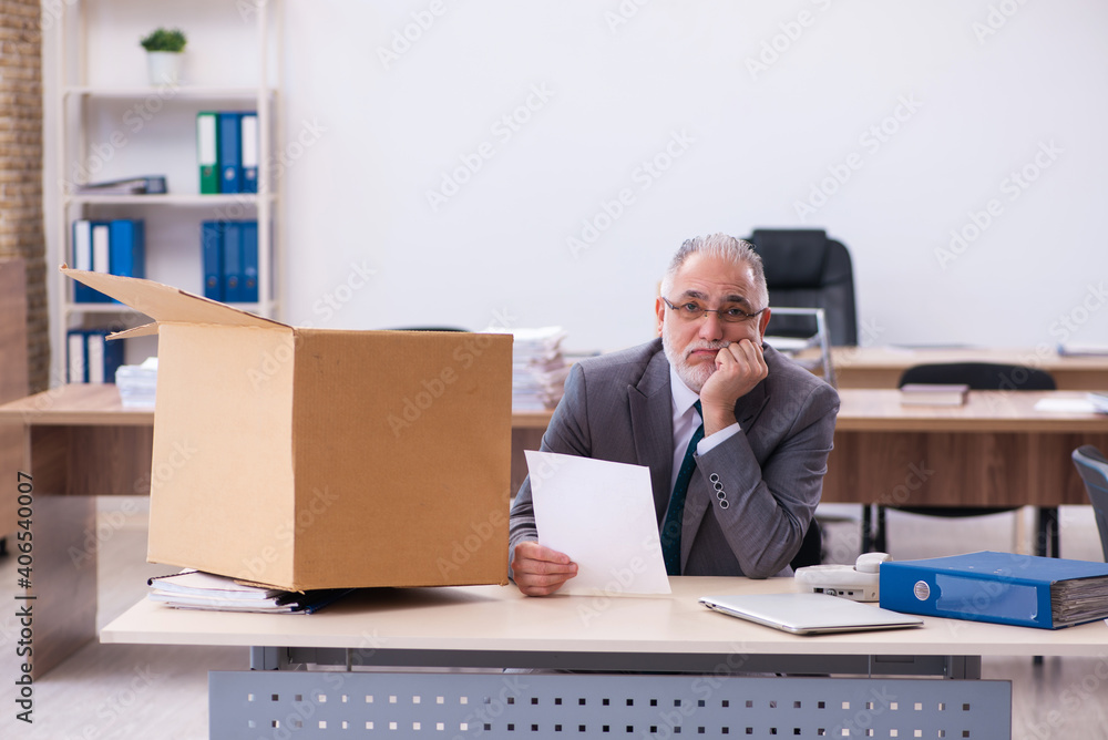 Old male employee being fired from his work Old male employee being fired from his work
