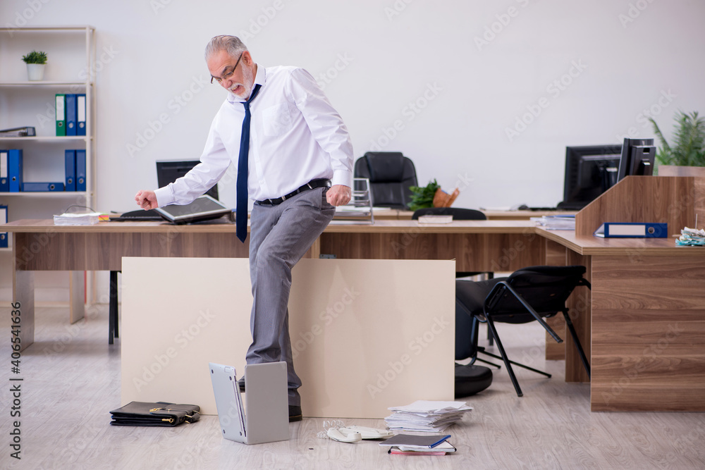 Old businessman employee in bankruptcy concept in the office Old businessman employee in bankruptcy concept in the office