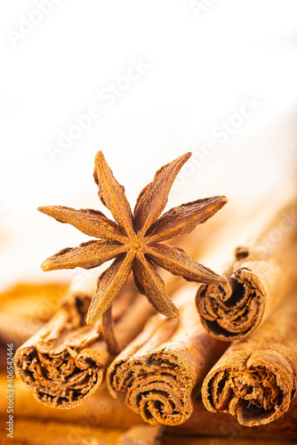 Cinnamon sticks and powder with star anise on copy space