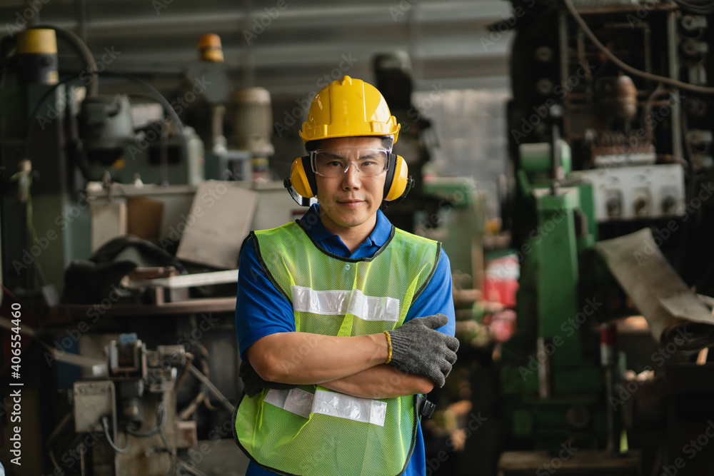 Professional worker asian man. Inspection technician, factory engineer, inspection of the machine condition in the factory. Inspection by technicians, industrial business, production machinery Professional worker asian man. Inspection technician, factory engineer, inspection of the machine condition in the factory. Inspection by technicians, industrial business, production machinery