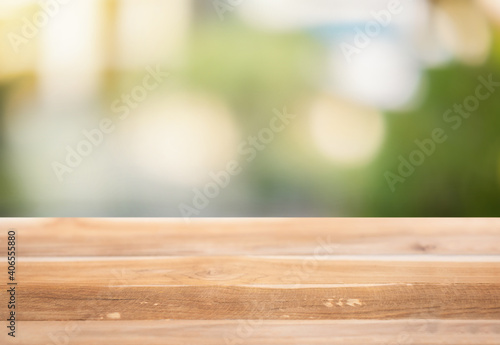 Wooden surface on a blurred natural background