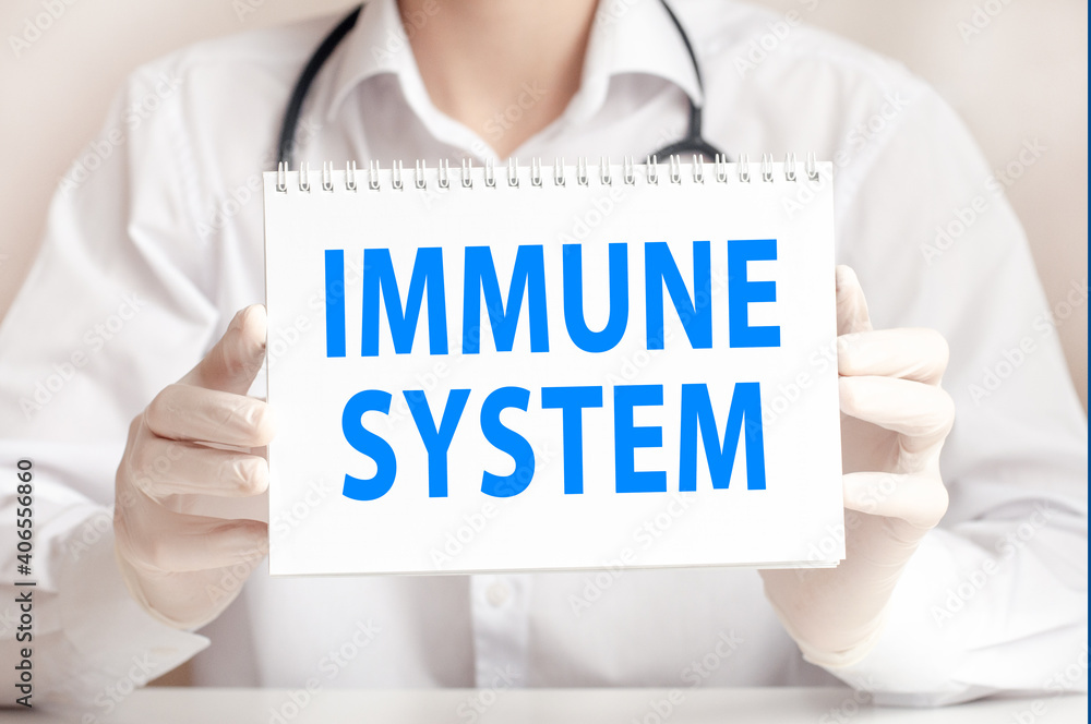Doctor showing a card with text IMMUNE SYSTEM, medicine concept Doctor showing a card with text IMMUNE SYSTEM, medicine concept