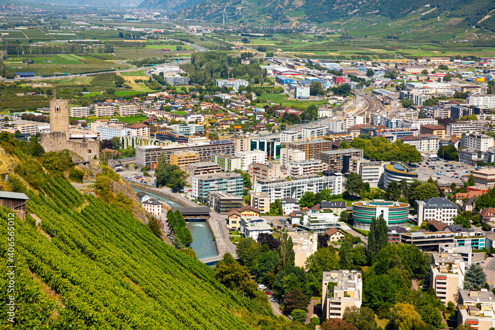 Picturesque aerial view of Martigny city in Rhone valley at foot of Swiss Alps