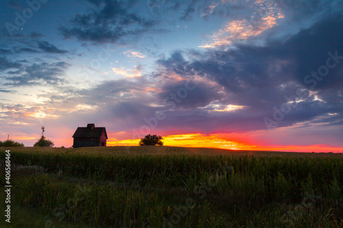 Old weathered barn at sunset