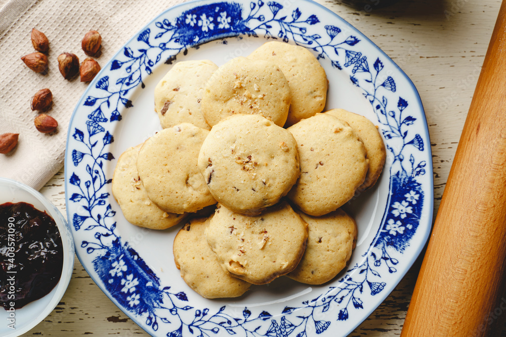 Homemade hazelnuts cookies in a plate - top view baked sweet food traditional recipe - healthy eating concept Homemade hazelnuts cookies in a plate - top view baked sweet food traditional recipe - healthy eating concept