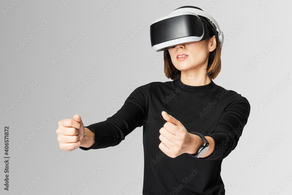 Woman with VR playing racing game Woman with VR playing racing game
