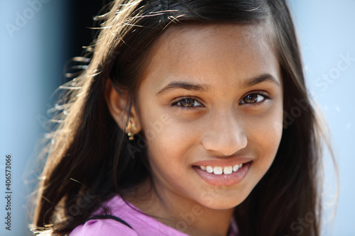 Beautiful Indian little girl posing to the camera.