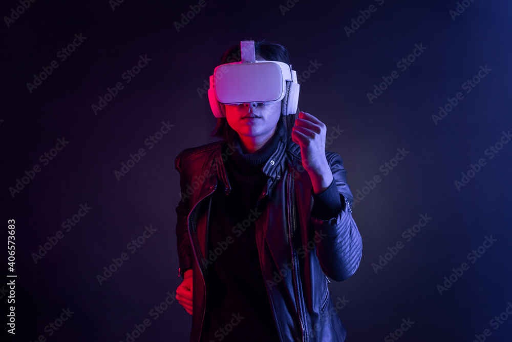 Woman using virtual reality gadget for entertainment