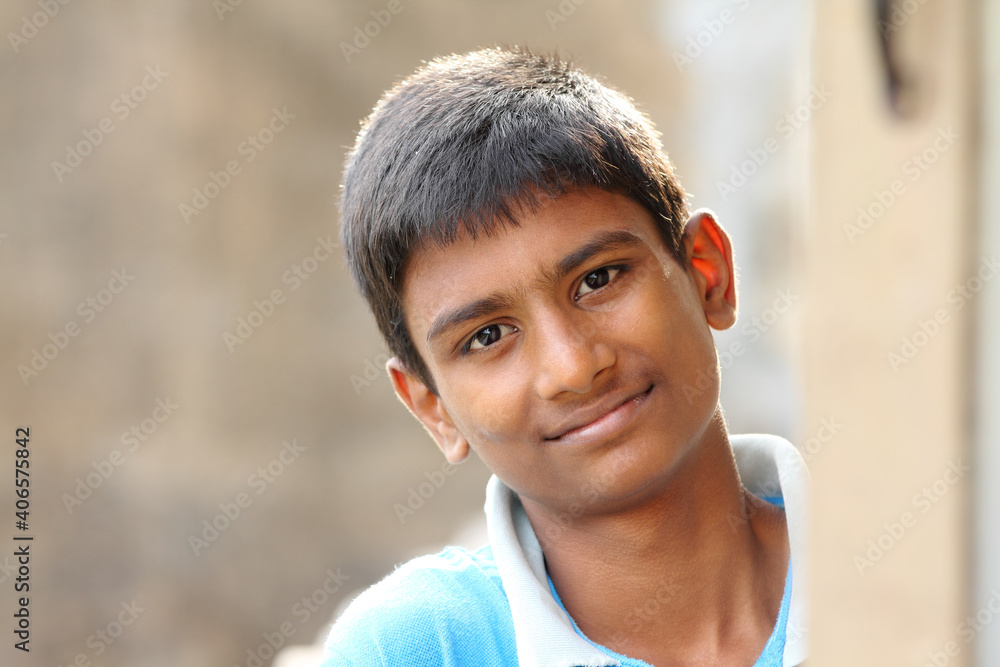 Indian teen boy portrait in outdoor background.