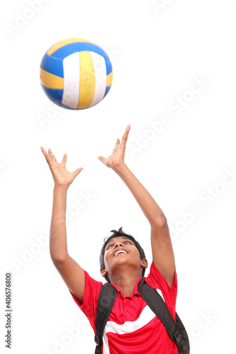 Cheerful Indian teen with volley ball.