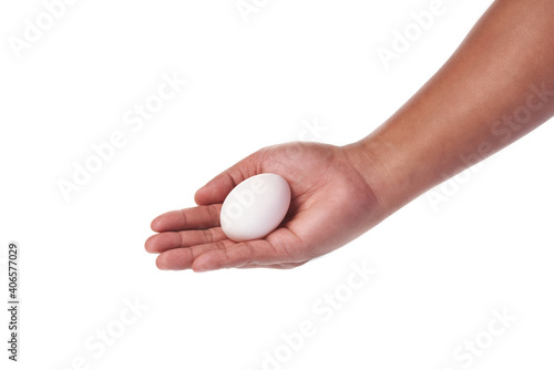 white egg in hand on white background