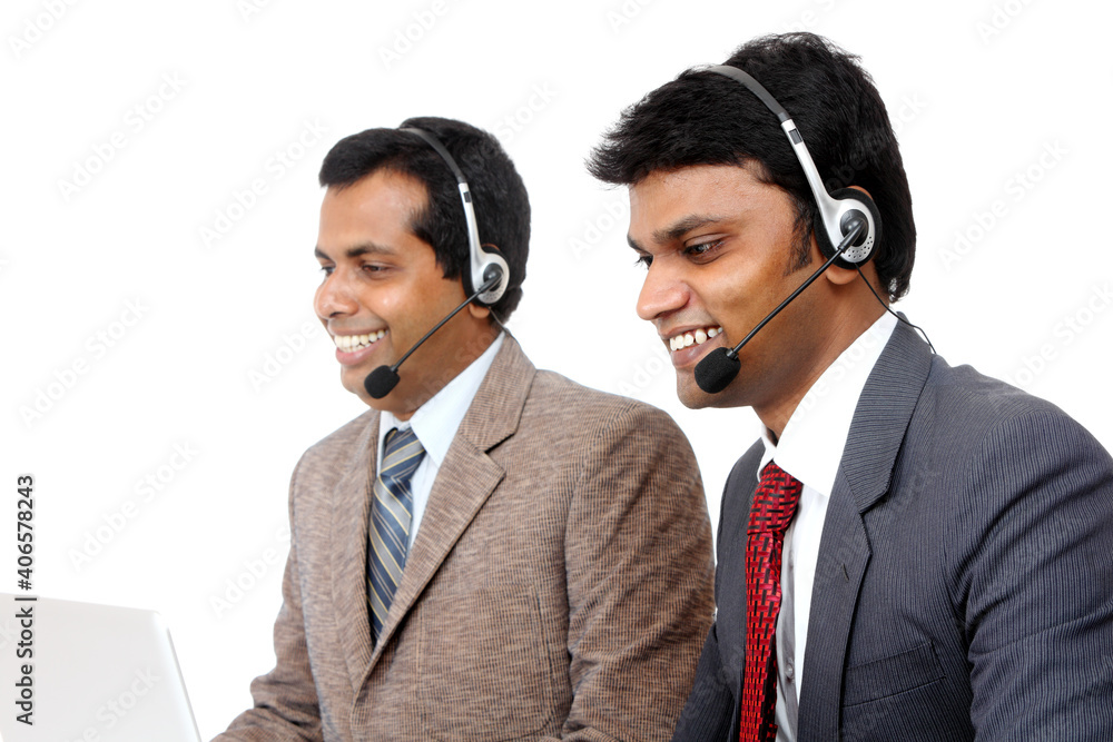 Indian young people working in call center isolated on white. Indian young people working in call center isolated on white.