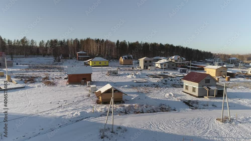 Aerial view of Houses under construction in winter cottage village. There are forests and fields around the village. There are free ground for construction
Aerial view of Houses under construction in winter cottage village. There are forests and fields around the village. There are free ground for construction