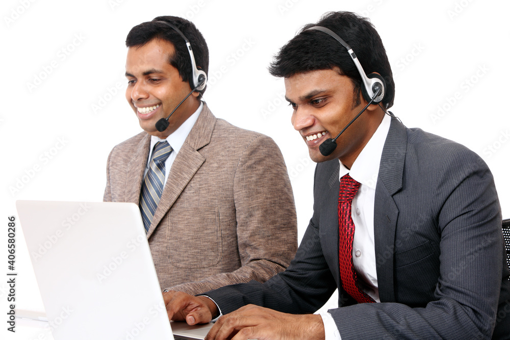Indian young people working in call center isolated on white. Indian young people working in call center isolated on white.