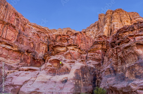 Jordan, Wadi Rum, a person is climbing a the rock. 