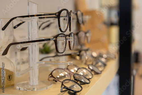 Close up glasses in optics store. Showcase spectacles in Optical shop. © JR-50