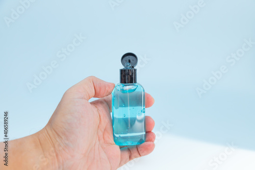 Hold a small alcohol gel bottle for hand protection