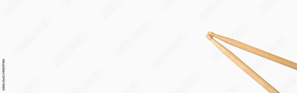 Drum sticks on a white background, top view. Banner, copy space. Drum sticks on a white background, top view. Banner, copy space.